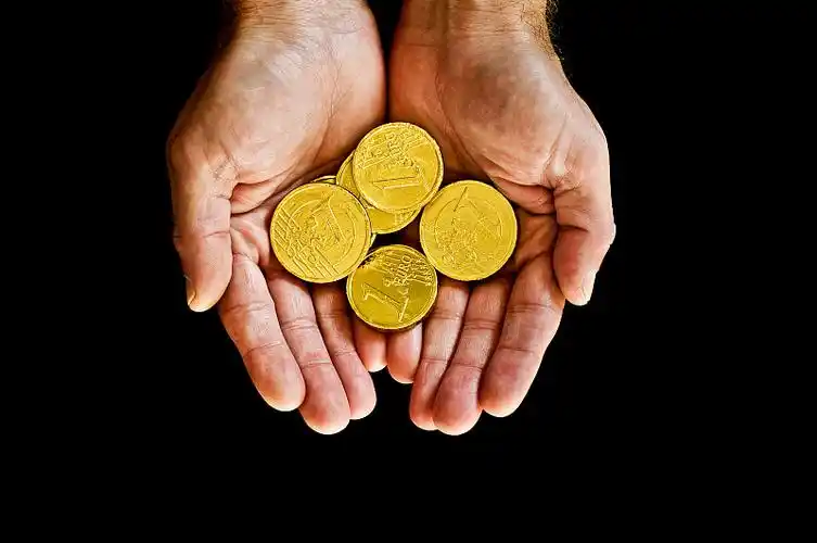 A slice of keto vanilla cake served on a white plate with a fork.
